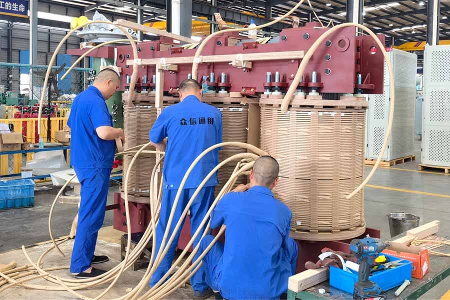 16000kVA oil-immersed transformer tap changer lead insulation wrapping in progress — Zhongxin General factory