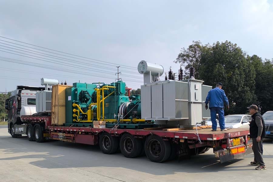 Two 5000kVA oil-immersed transformers loaded on trucks for dispatch — Zhongxin General factory
