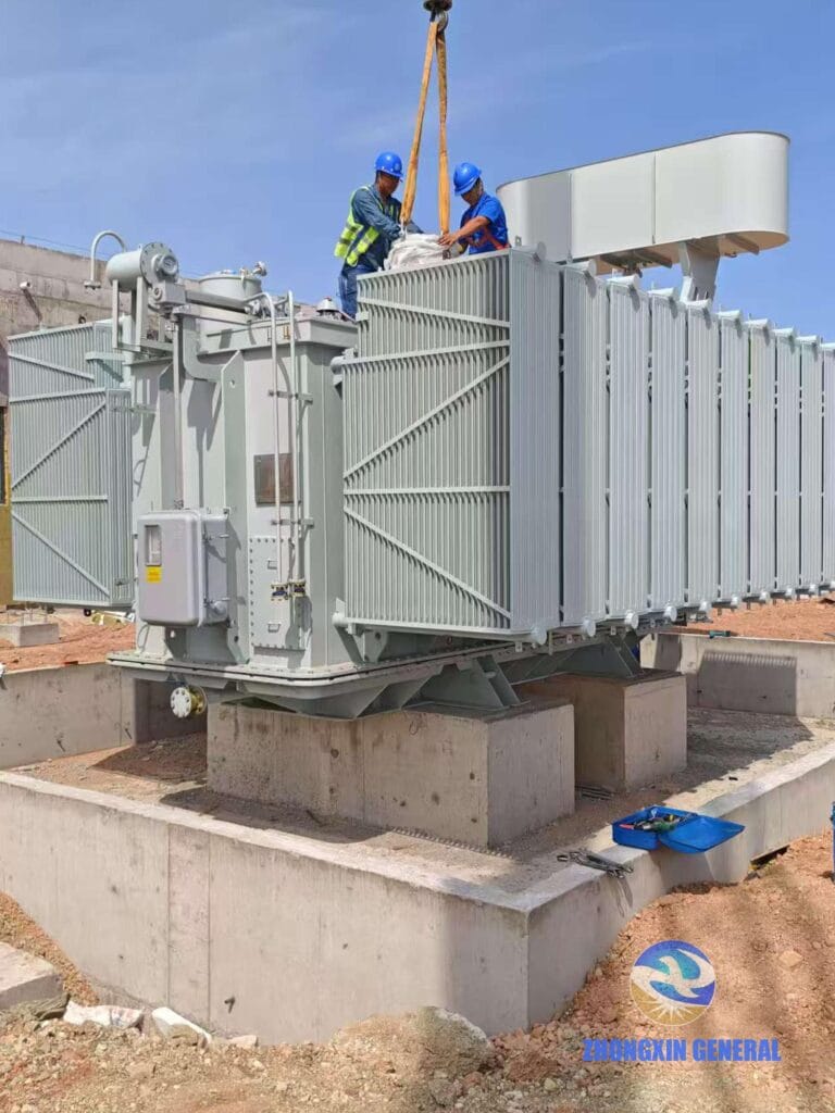 Installation crew assembling ONAN cooling radiators on 63MVA oil-immersed transformer at Gaoshawo Industrial Zone, Ningxia