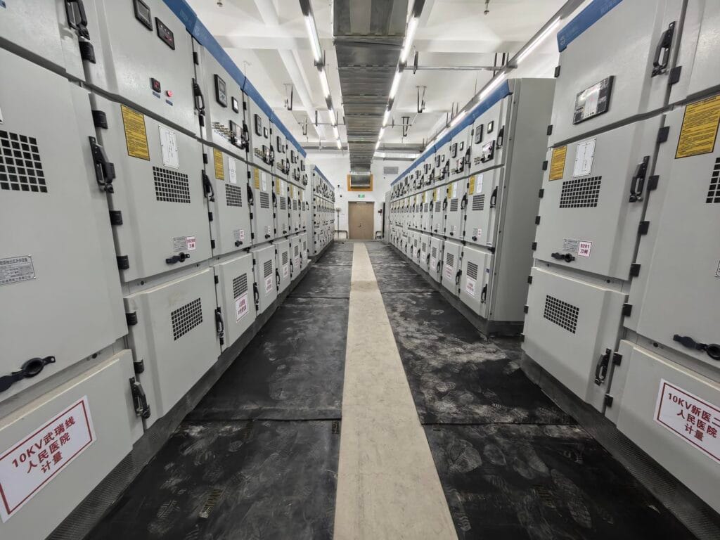Front view of GCS low-voltage switchgear lineup in Xinjin Hospital power distribution room by Zhongxin General