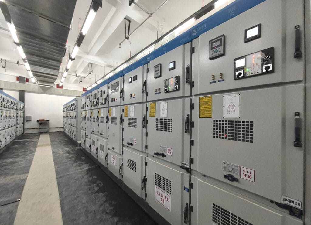 Complete view of single-row switchgear lineup with intelligent monitoring displays at Xinjin Hospital power room