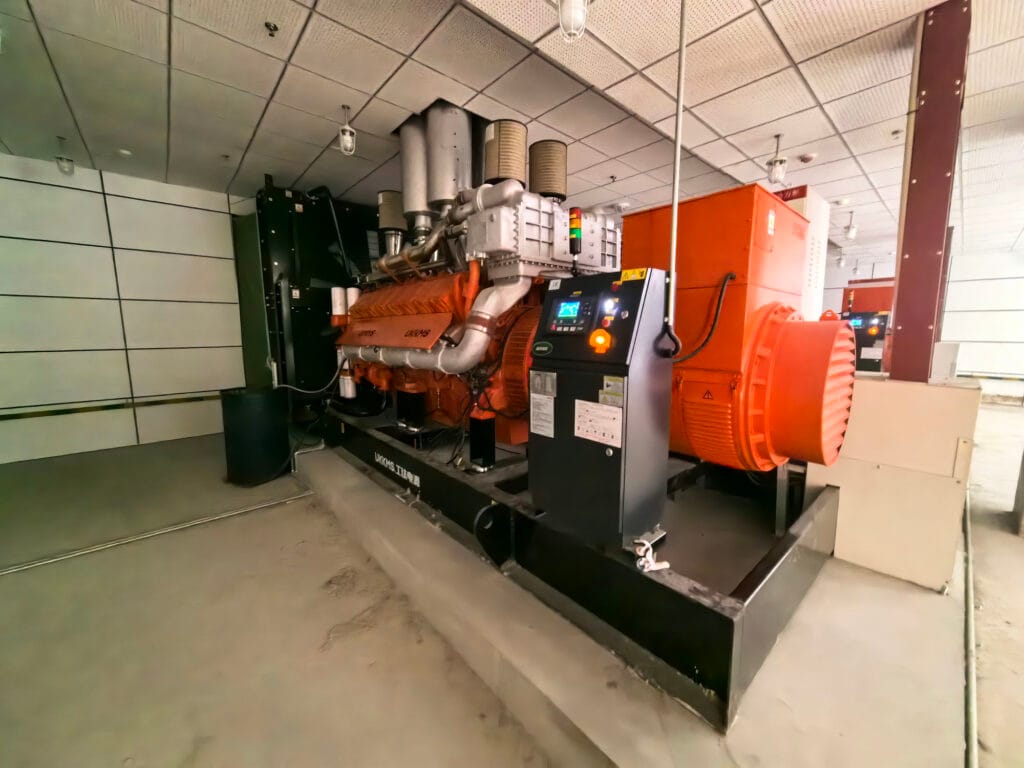 Alternative angle of 1800kW diesel generator installation showing professional layout and safety infrastructure