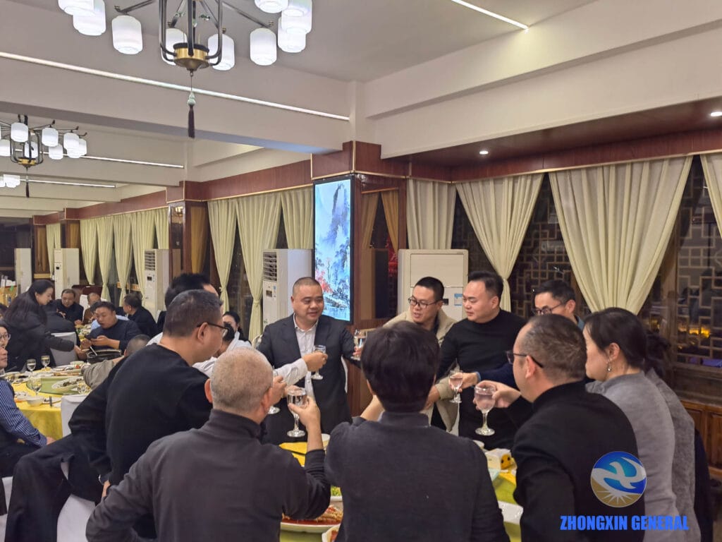 Chairman Li Xia sharing toasts with marketing teams at annual banquet tables