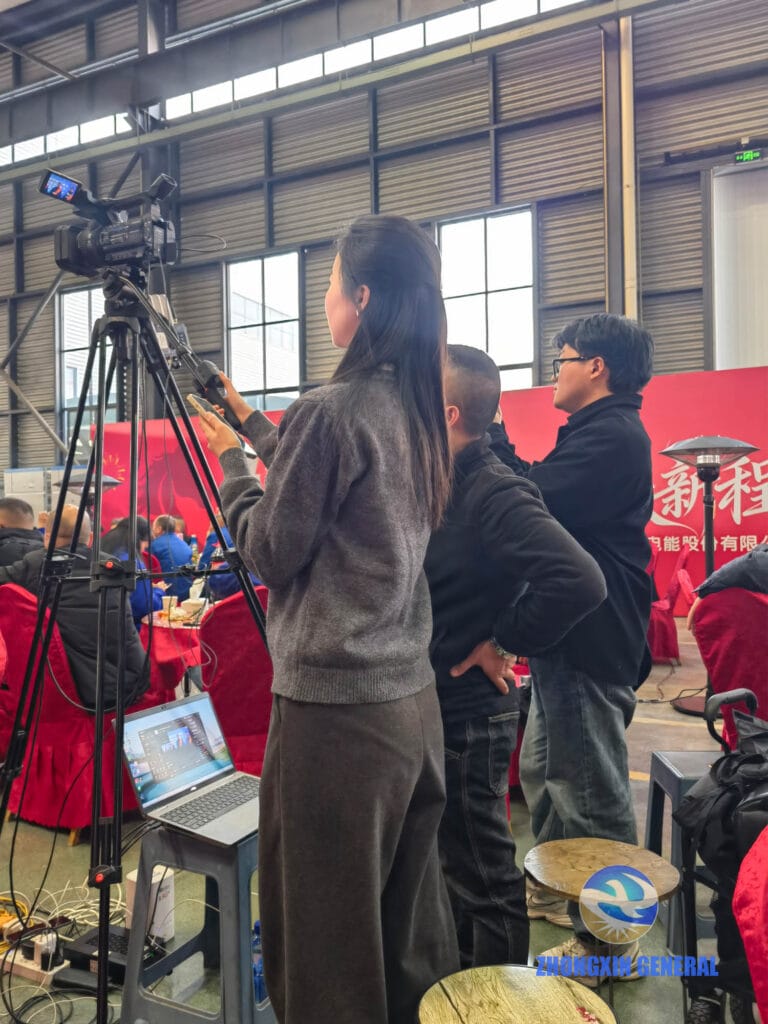 Professional livestream operator managing HD camera equipment at company annual gala event