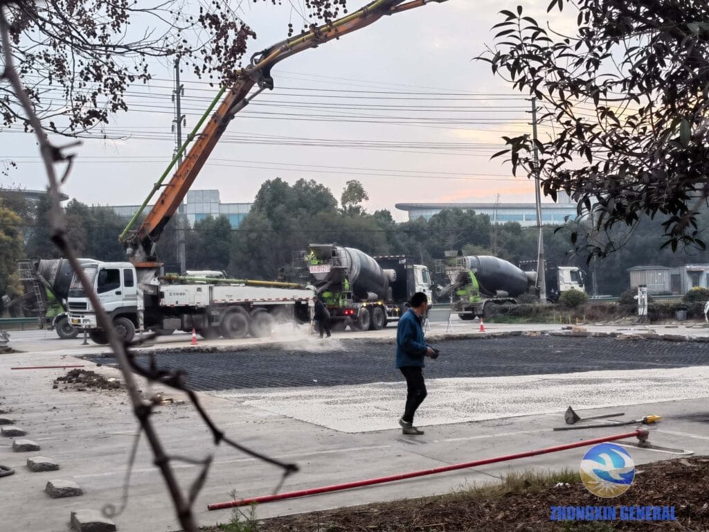 Complete view of EV charging station ground renovation construction site from dormitory building