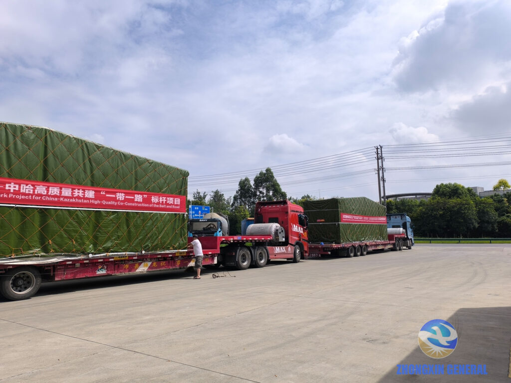 Five 17.5-metre flatbed trailers loaded with prefabricated substation modules — convoy ready to depart Zhongxin General factory for Kazakhstan September 2025