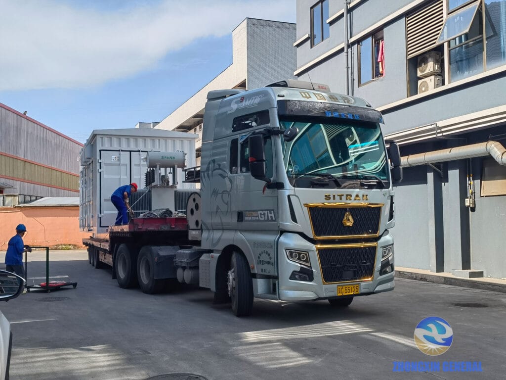 Second prefabricated box substation being secured on transport truck — Zhongxin General PetroChina Luntai Xinjiang April 17 2026