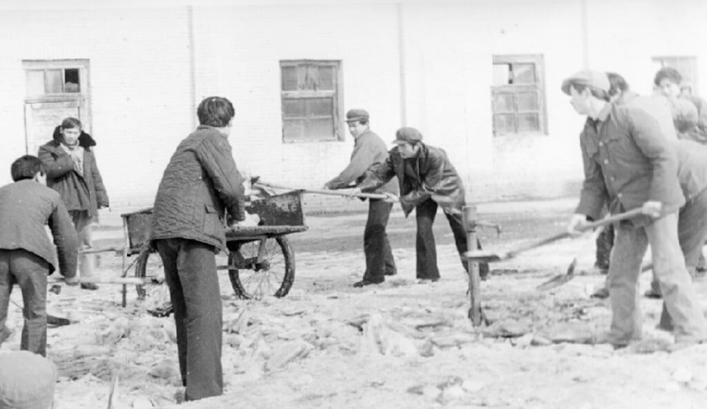 TBEA employees working together to salvage materials and rebuild the collapsed factory workshop after a heavy snowfall in 1988