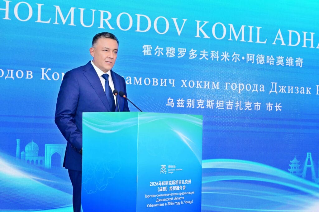 Mayor HOLMURODOV KOMIL ADHAMOVICH of Jizzakh City delivering a formal address at the Jizzakh investment promotion event hosted by Chengdu Commercial Association, May 22, 2026, Chengdu