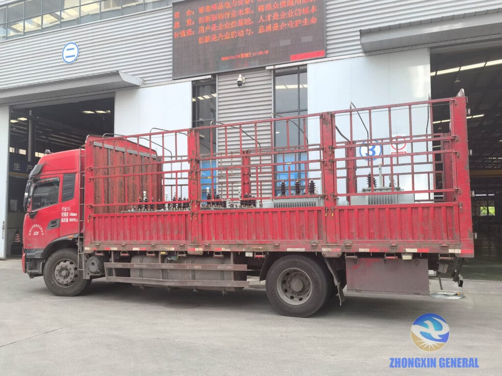 Batch of oil-immersed distribution transformers fully loaded on truck at factory — ready to depart Zhongxin General Sichuan