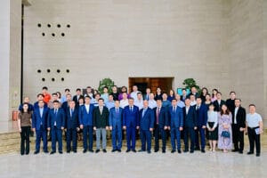 Group photo of all attendees at the Jizzakh State and City Government investment promotion event hosted by Chengdu Commercial Association, May 22, 2026, including Zhongxin General representatives