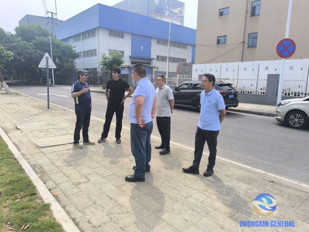 Zhongxin General team and Peruvian clients at the Chengdu Fangxin Cold Rolling Factory Energy Storage Project site — 5.175 MW / 10.03 MWh commissioned industrial energy storage system, Chengdu's first 10 kV high-voltage user-side energy storage project