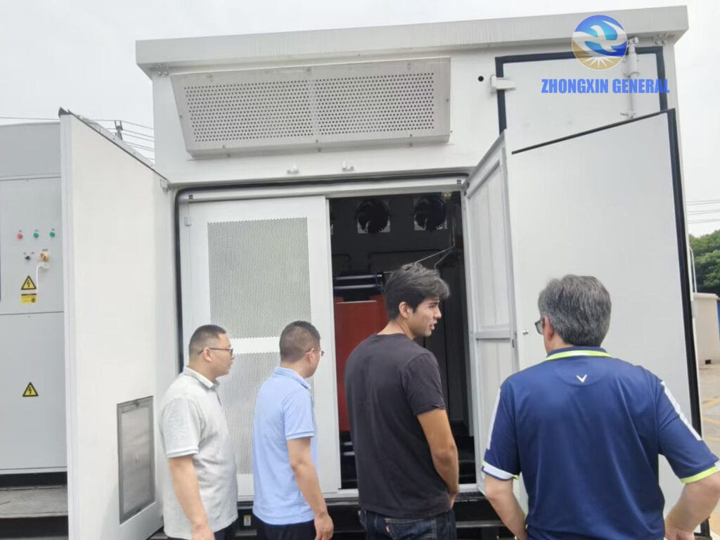 Zhongxin General team and Peruvian energy storage clients inspecting the step-up and step-down transformer cabin at the Chengdu Fangxin Cold Rolling Factory Energy Storage Project site visit, 2025