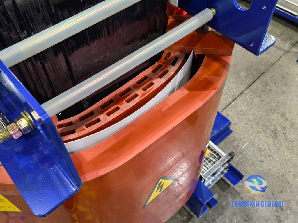 1000 kVA dry-type transformer core and coil assembly detail — painted laminated silicon steel core and HV LV winding air gap spacing Zhongxin General