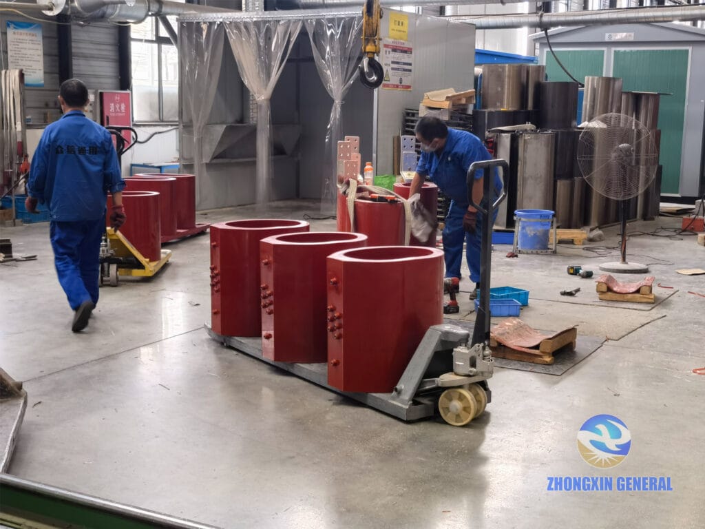 1000 kVA dry-type transformer HV epoxy cast winding after demoulding entering grinding room for surface finishing — Zhongxin General factory