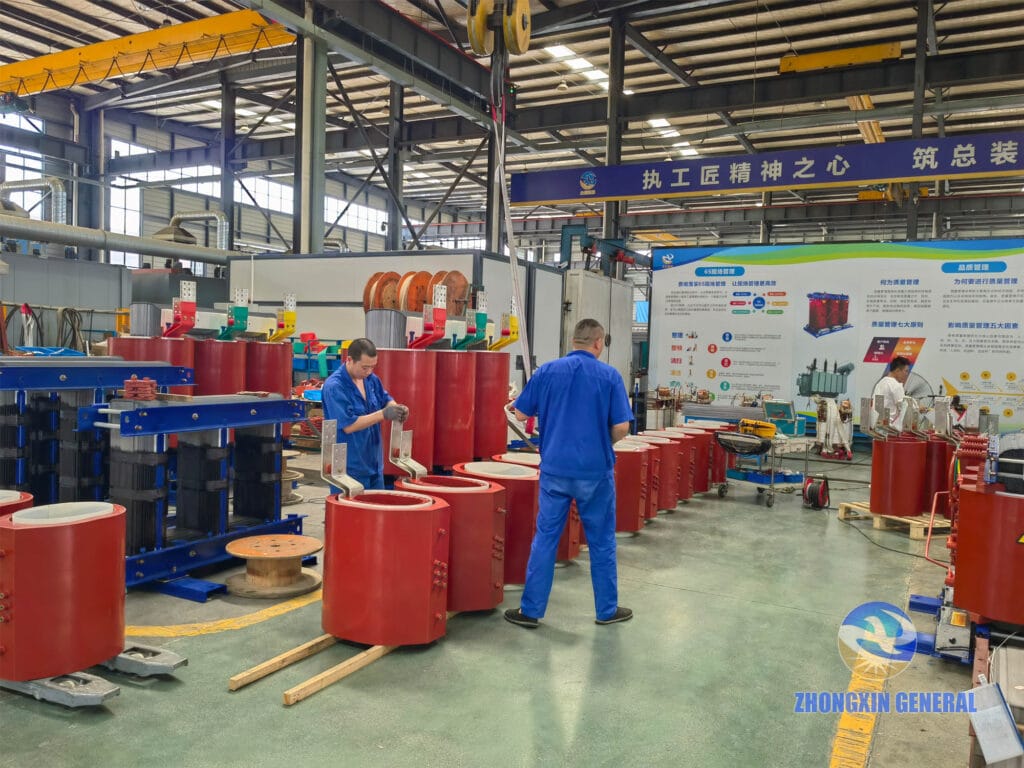 Technician installing LV copper busbars on 1000 kVA dry-type transformer low-voltage windings — Zhongxin General factory