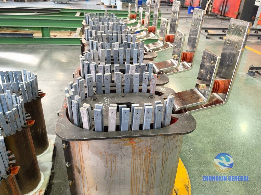 Multiple 1000 kVA dry-type transformer LV windings after epoxy casting awaiting entry into hot-air curing oven — Zhongxin General factory