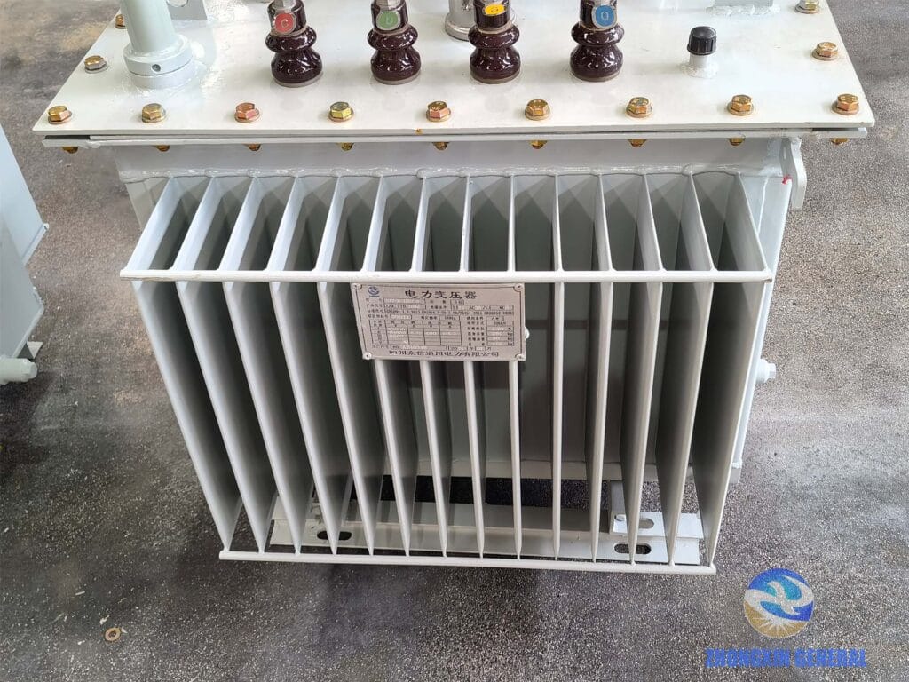 Corrugated fin radiator tank close-up of 100 kVA oil-immersed transformer — ONAN cooling Zhongxin General