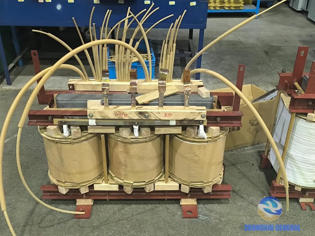 Lead wire sleeving and assembly process for 100 kVA oil-immersed transformer — Zhongxin General manufacturing