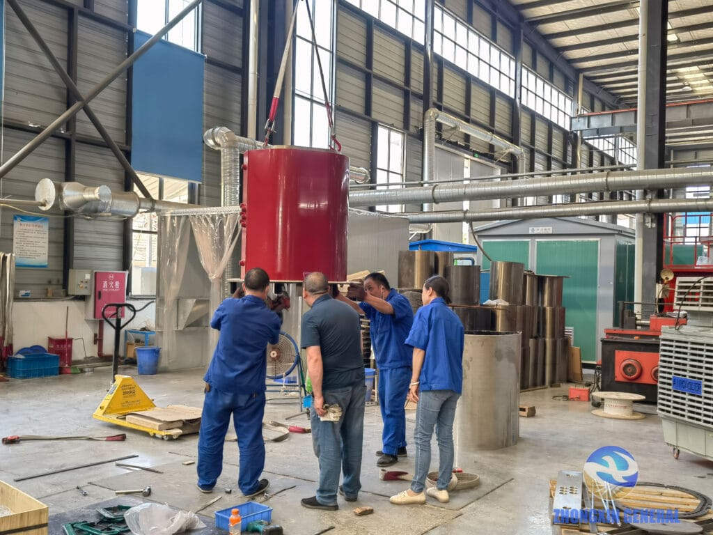 High-voltage epoxy cast winding of 1250 kVA dry-type transformer during demoulding — Zhongxin General production