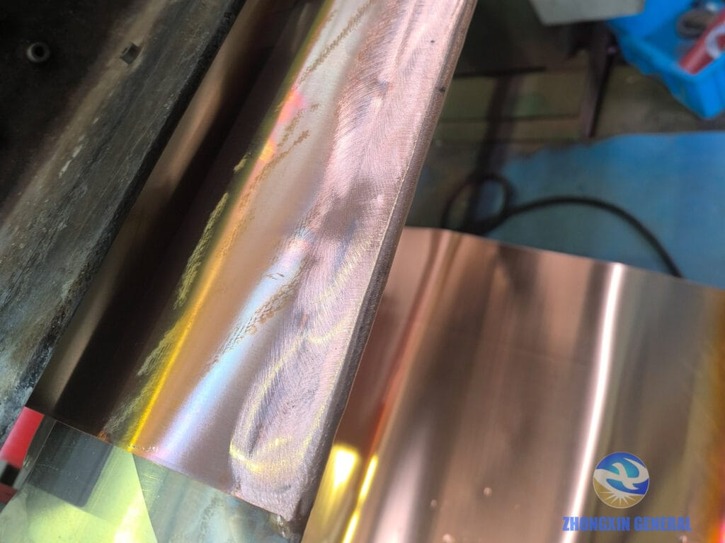 Low-voltage foil winding process of 1250 kVA dry-type transformer — copper foil and output busbar welding detail Zhongxin General factory