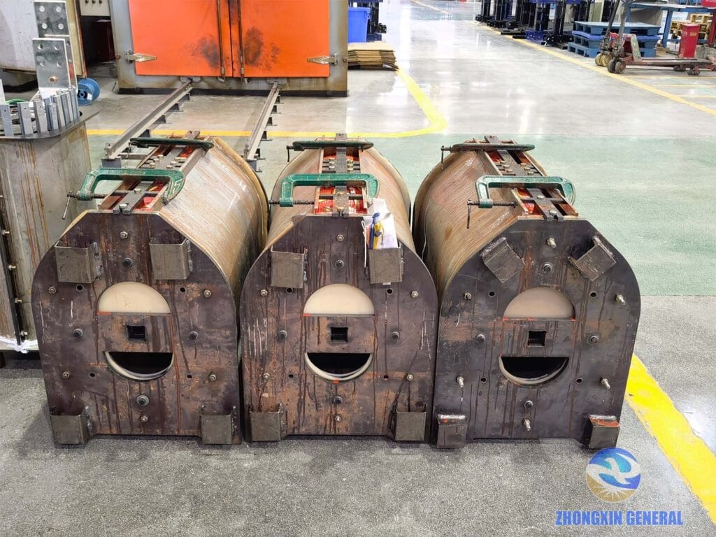 Three 1600 kVA dry-type transformer HV windings after mould completion awaiting hot-air curing oven — Zhongxin General factory