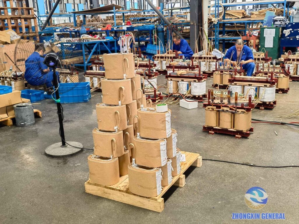 Skilled technicians processing lead wires on 160 kVA oil-immersed transformer active part — Zhongxin General factory