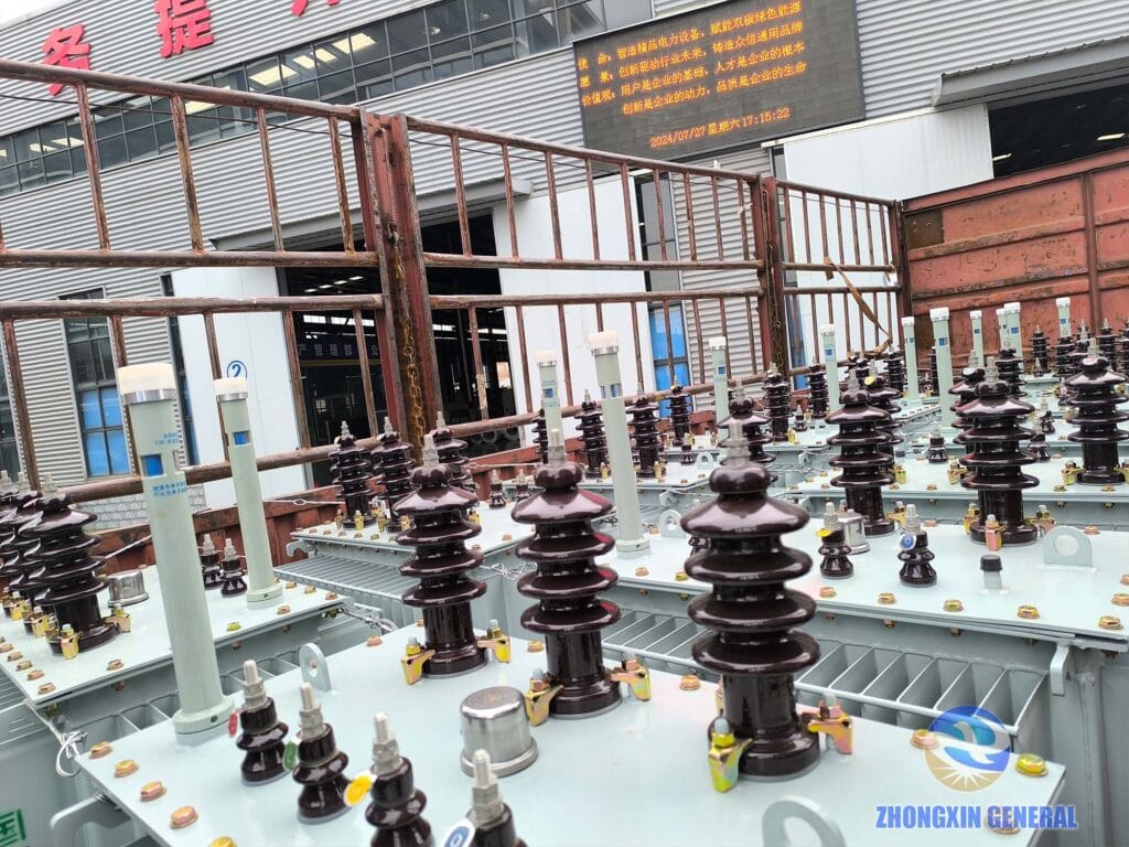 Batch of 200 kVA oil-immersed transformers fully loaded on truck at Zhongxin General factory — ready for dispatch