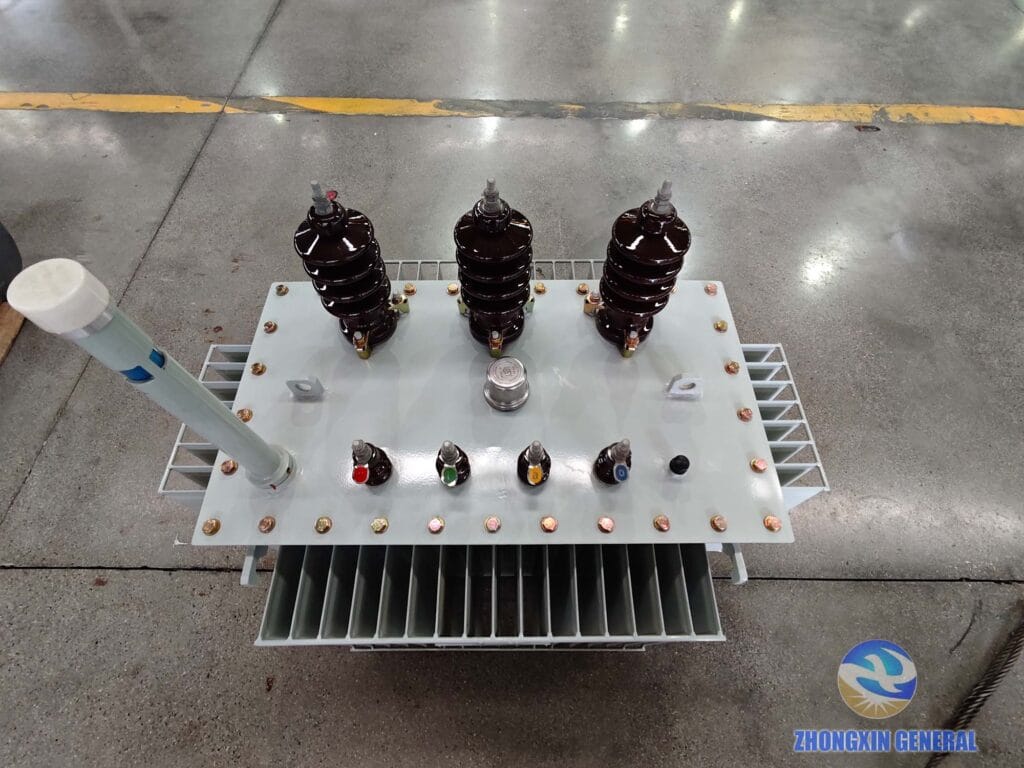 Top view of completed 200 kVA oil-immersed distribution transformer — oil conservator expansion tank HV LV terminals Zhongxin General