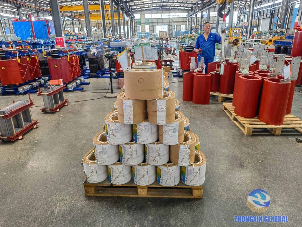HV and LV windings being assembled onto iron core — 200 kVA oil-immersed transformer Zhongxin General