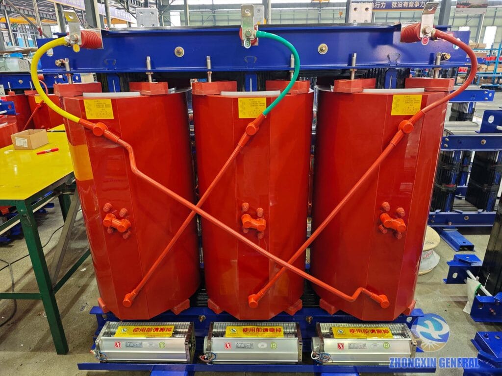 High-voltage terminal close-up of completed 2500 kVA cast resin dry-type transformer — 10kV HV bushings Zhongxin General