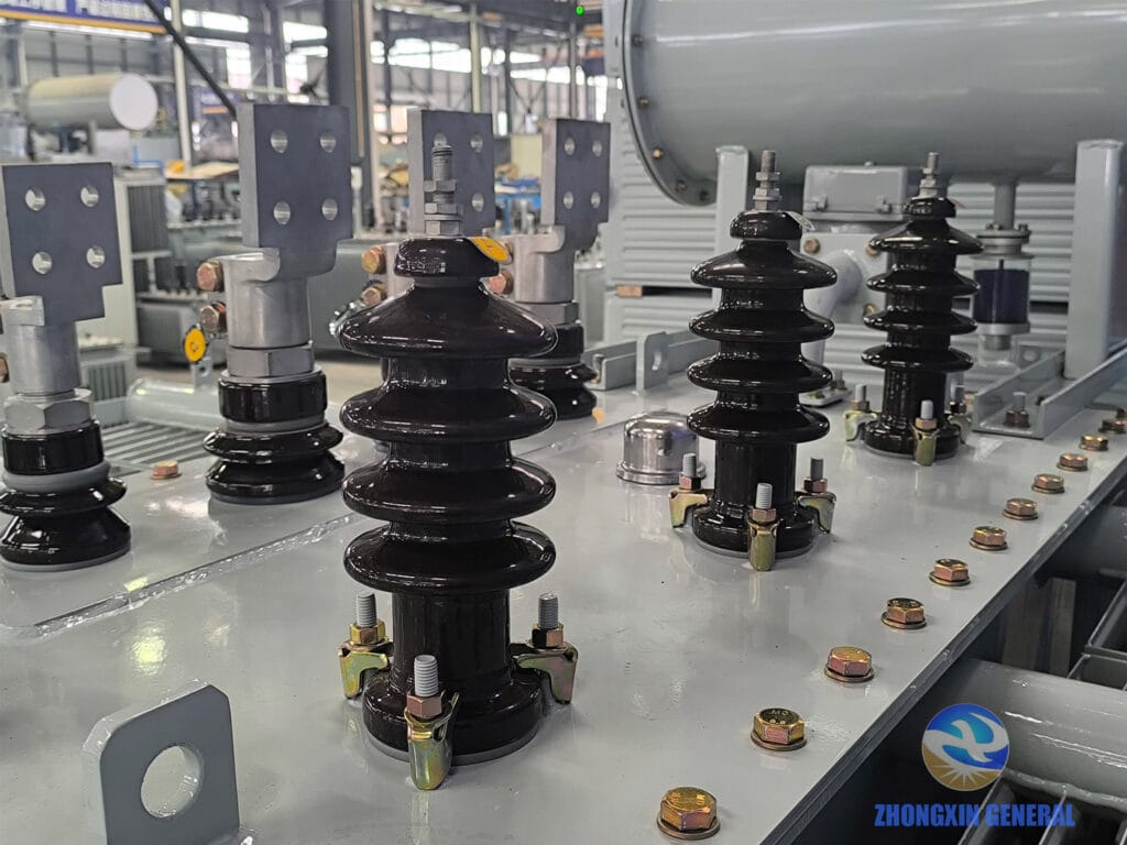 High-voltage side bushings and tap changer on 2500 kVA oil-immersed transformer — 10kV porcelain bushings Zhongxin General