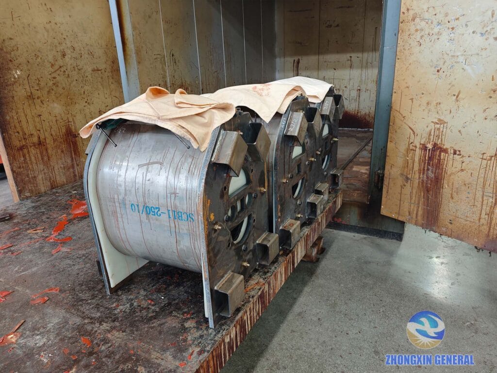 250 kVA dry-type transformer windings entering high-temperature curing oven for epoxy resin cure — Zhongxin General factory