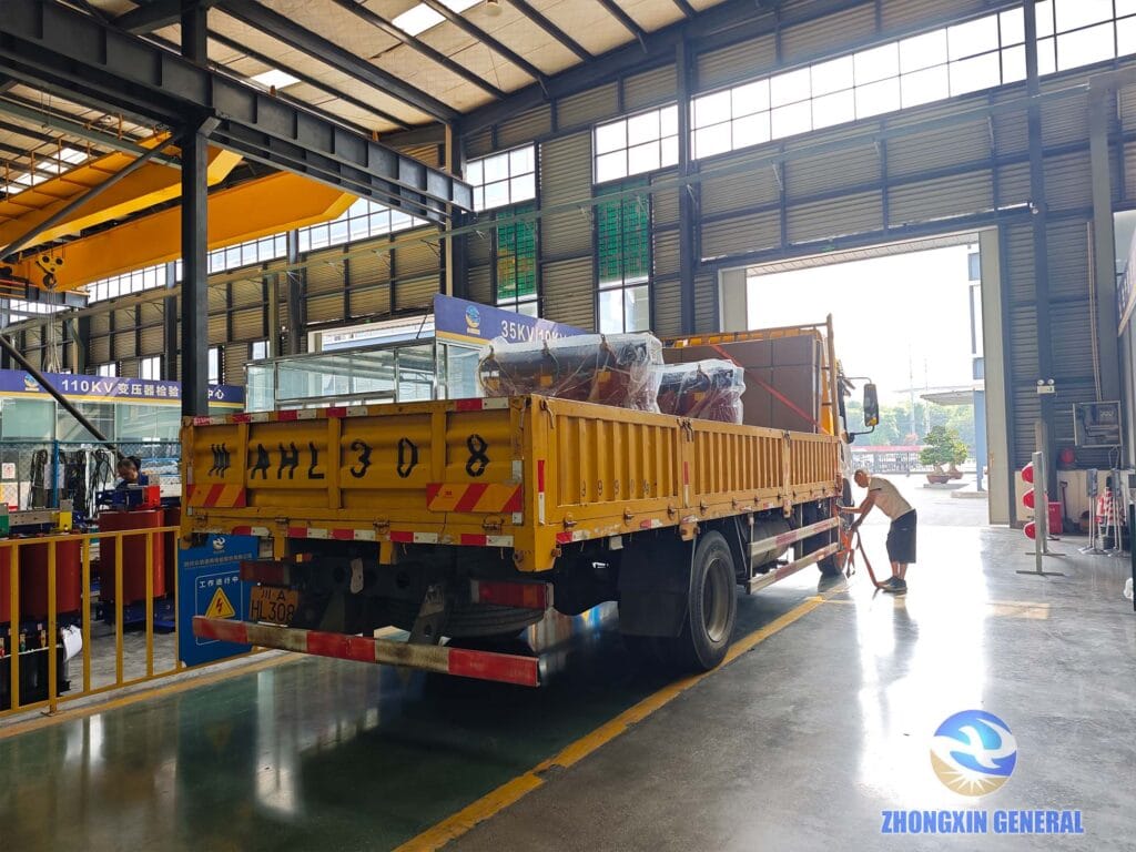 30 kVA dry-type transformer loaded onto delivery truck at factory gate waiting for dispatch to customer — Zhongxin General Sichuan