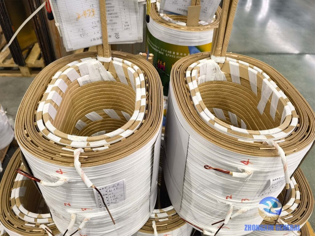 Two 400 kVA oil-immersed transformer winding coils completed — HV and LV close-up detail, Zhongxin General factory