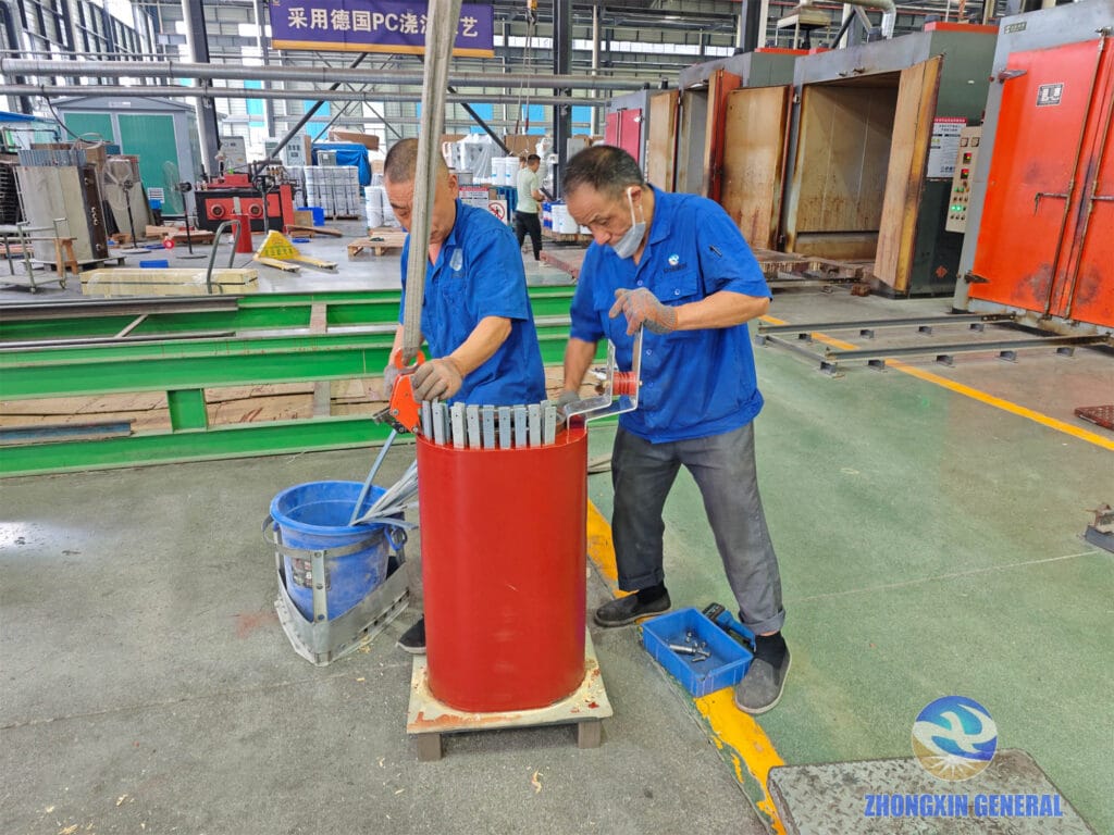 Technician removing ventilation strips from cured LV winding of 5000 kVA dry-type transformer — Zhongxin General