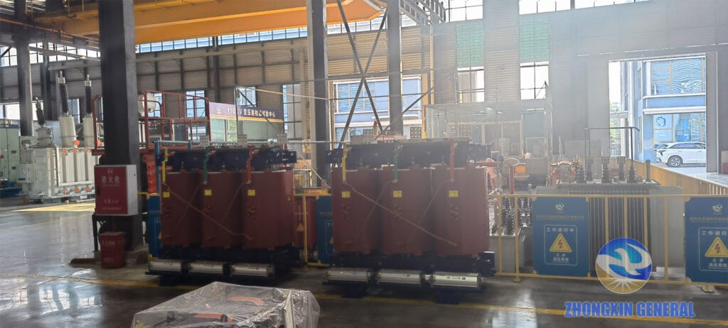 Two completed 5000 kVA cast resin dry-type transformers, front view of high-voltage side — Zhongxin General factory