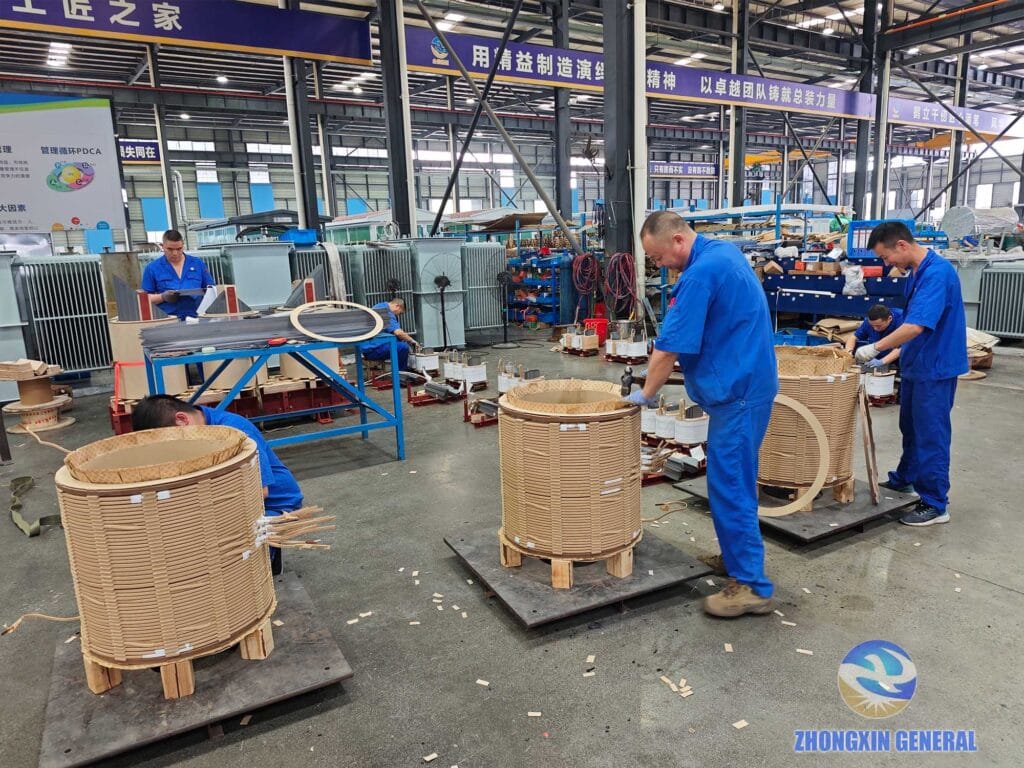 Technicians compacting oil-impregnated insulation paper on 5000 kVA transformer winding — Zhongxin General factory
