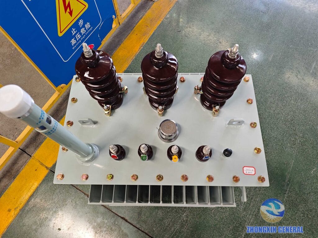 Top view of completed 50 kVA oil-immersed distribution transformer showing conservator and fittings — Zhongxin General