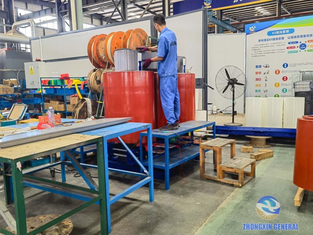 Technician performing initial assembly and inspection of 6300 kVA cast resin dry-type transformer — Zhongxin General factory