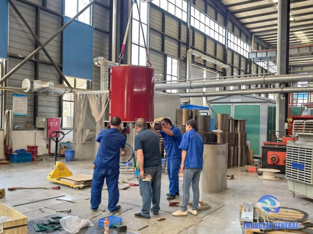 Technicians demoulding the low-voltage winding of a 6300 kVA cast resin dry-type transformer — Zhongxin General factory