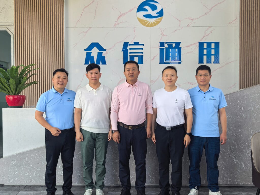 African diaspora leaders and Xingjin district officials group photo with Zhongxin General team — Chengdu Sichuan June 2026