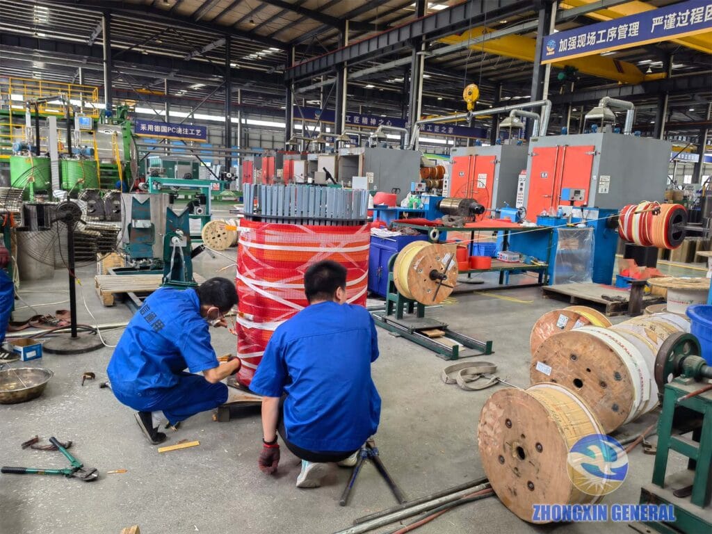 Senior technician inspecting foil-wound coil before insulation wrapping — cast resin dry-type transformer production Zhongxin General
