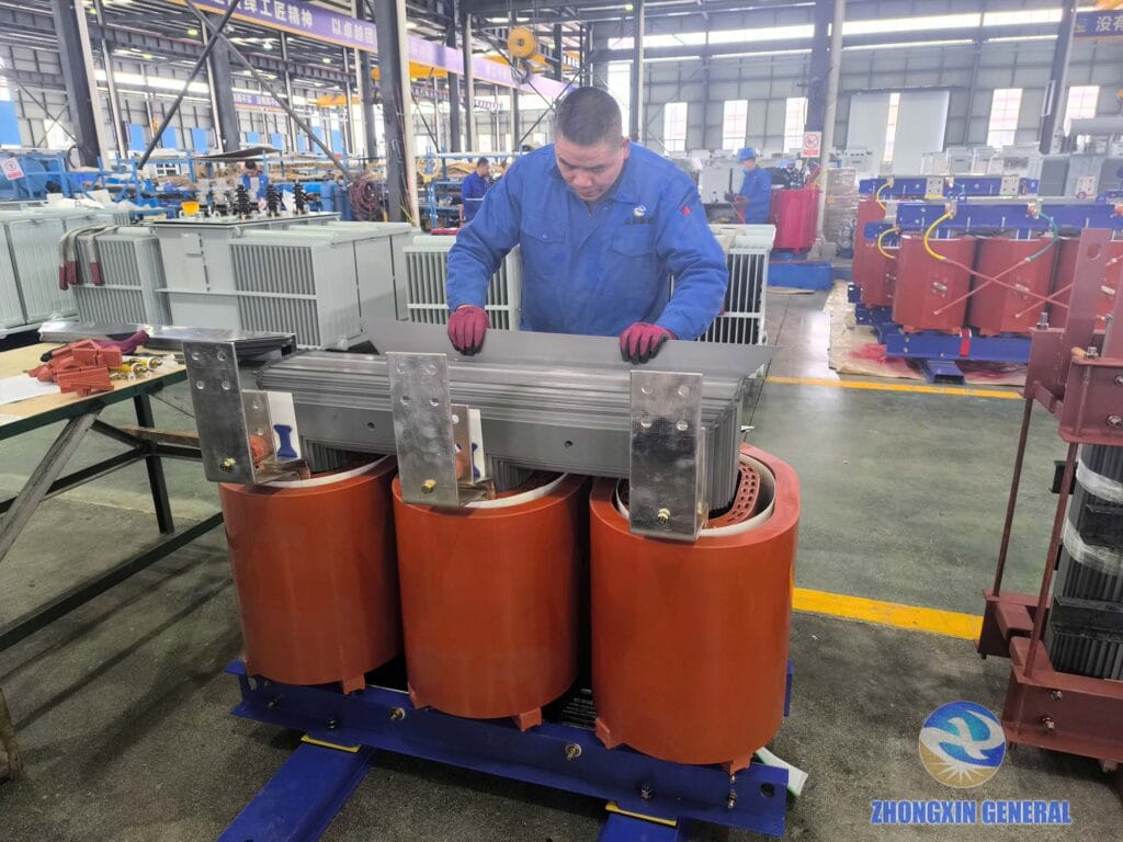 Senior technician performing iron core lamination stacking for cast resin dry-type transformer — Zhongxin General Sichuan factory