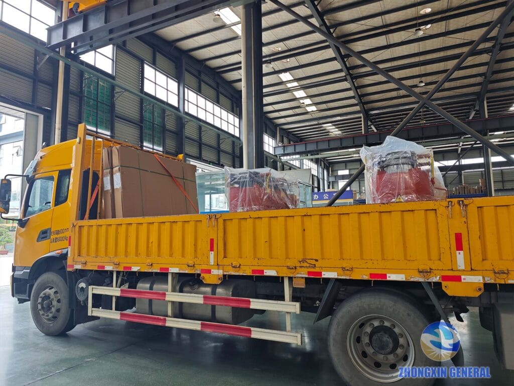 Two completed dry-type transformers loaded on truck ready for dispatch from Zhongxin General factory