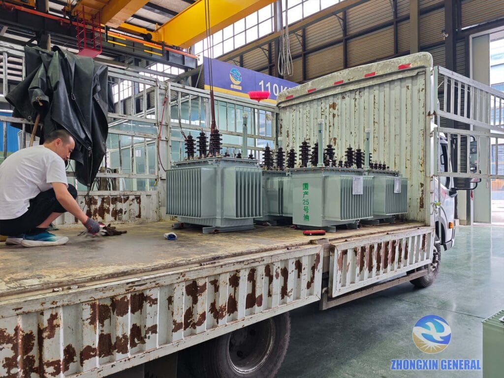 Oil-immersed distribution transformers being loaded onto truck for dispatch — Zhongxin General Sichuan factory