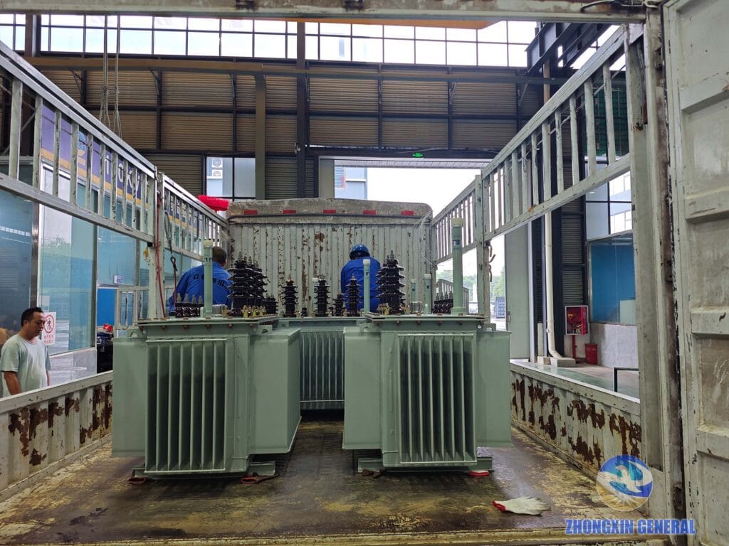 Oil-immersed distribution transformers being loaded onto truck for dispatch — Zhongxin General Sichuan factory