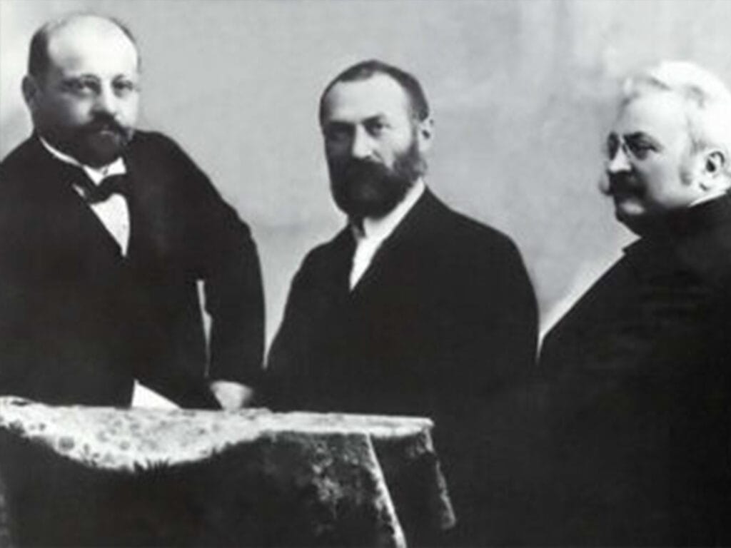 Historical 1885 portrait of ZBD transformer inventors Déri, Bláthy, and Zipernowsky at Ganz Works