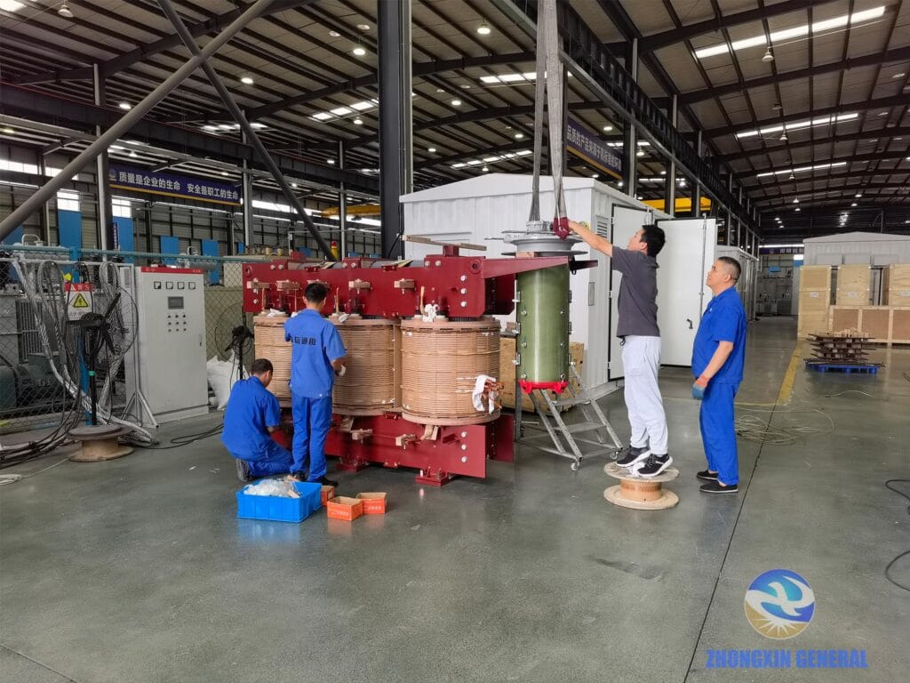 Technicians installing HV/LV leads and on-load tap changer on a 10000kVA transformer