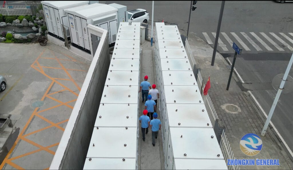 Aerial view of the Chengdu Xinjin Fangxin 10MW/h user-side battery storage project with technician inspecting the battery container aisle